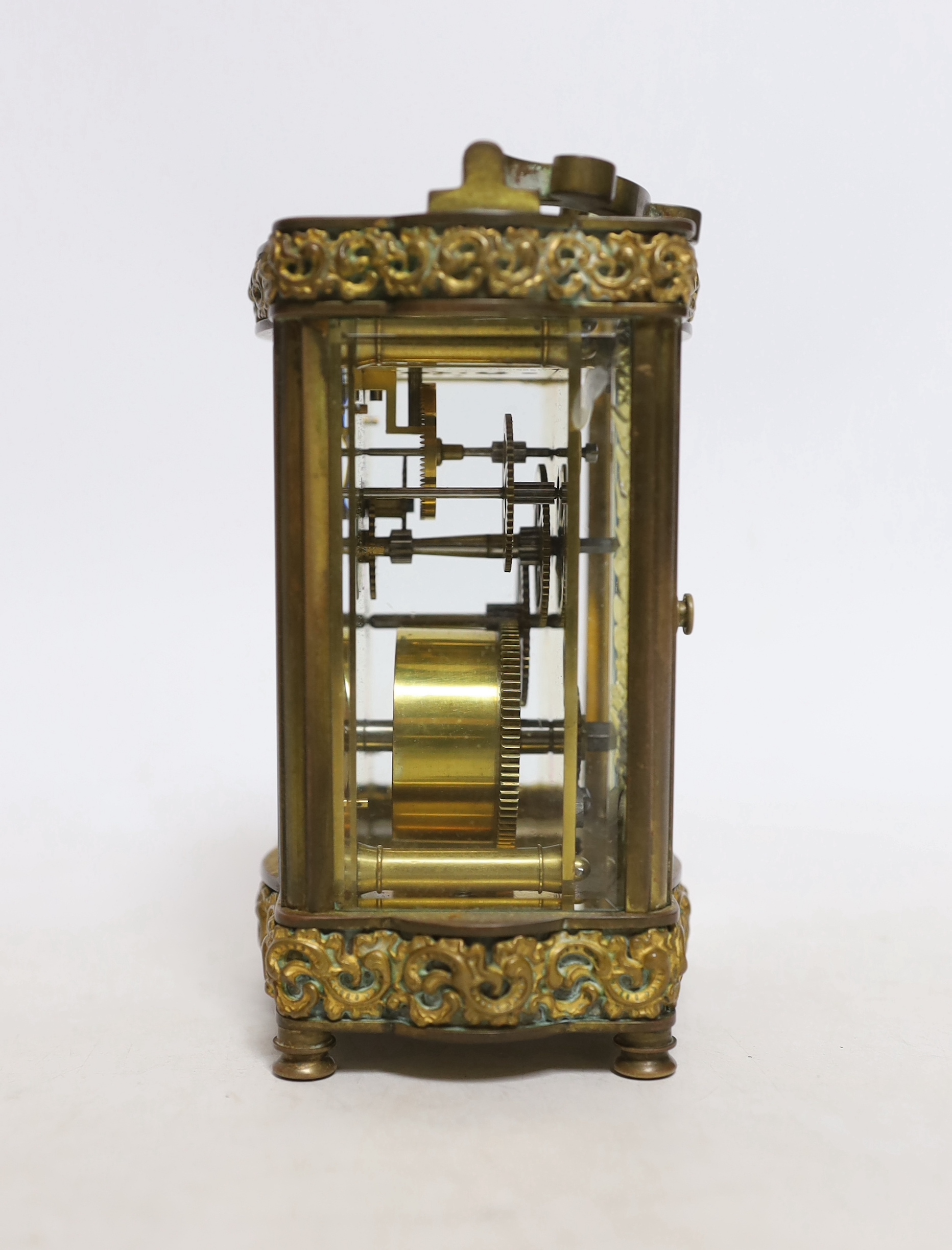 An early 20th century oak cased carriage timepiece, timepiece 12cm high